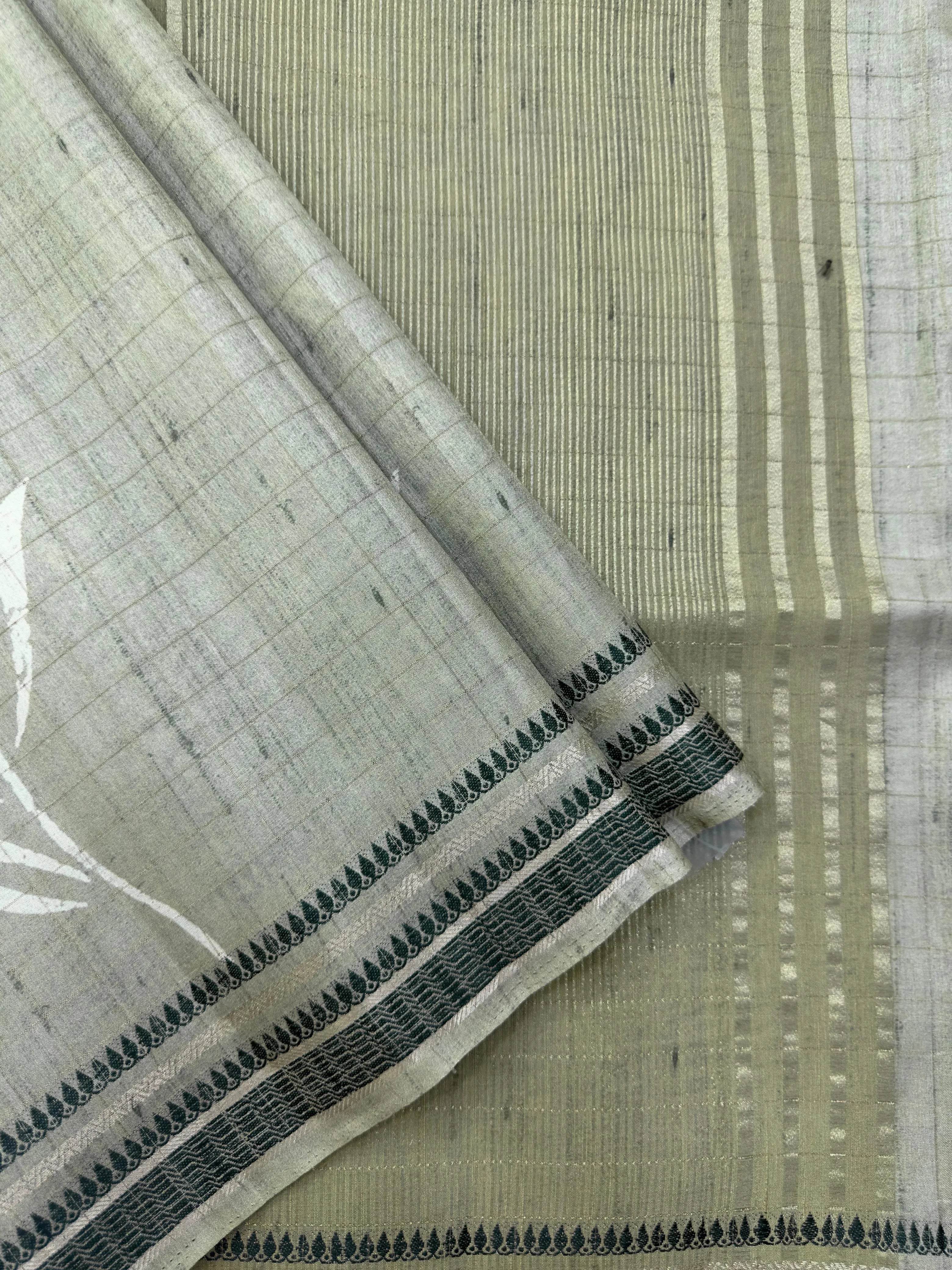 “Woman wearing a lightweight Tussar silk saree in earthy tones, featuring a soft natural sheen and subtle patterns—ideal for elegant daily wear.”