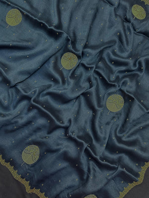 Woman draped in a Tussar Silk Saree with golden sheen and textured finish, ideal for ethnic events, poojas, and cultural functions.