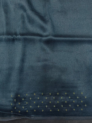 Woman draped in a Tussar Silk Saree with golden sheen and textured finish, ideal for ethnic events, poojas, and cultural functions.