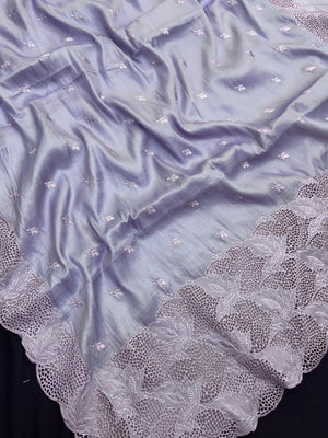 “Elegant woman wearing a graceful Tussar silk saree with a soft sheen, fine texture, and minimalistic patterns—ideal for regular wear with a touch of timeless sophistication.”