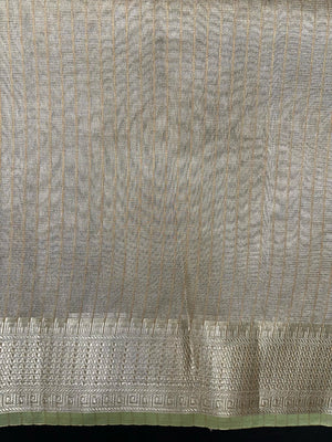 Woman wearing a Tussar Silk Saree with natural texture and subtle sheen, ideal for weddings, festivals, and cultural events.