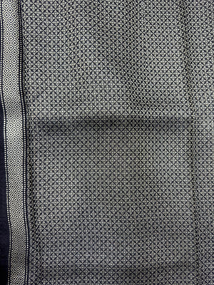 A graceful Tussar Silk Saree featuring rich texture and a natural sheen, designed for daily wear. The saree drapes elegantly, offering comfort and timeless beauty for everyday occasions.