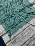 Woman wearing a Binny Crepe Saree with soft, flowing drape and minimal sheen, ideal for office and everyday wear.