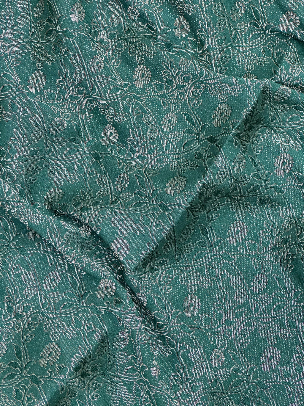 Woman wearing a Binny Crepe Saree with soft, flowing drape and minimal sheen, ideal for office and everyday wear.