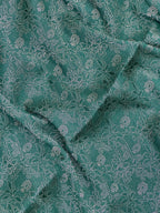 Woman wearing a Binny Crepe Saree with soft, flowing drape and minimal sheen, ideal for office and everyday wear.