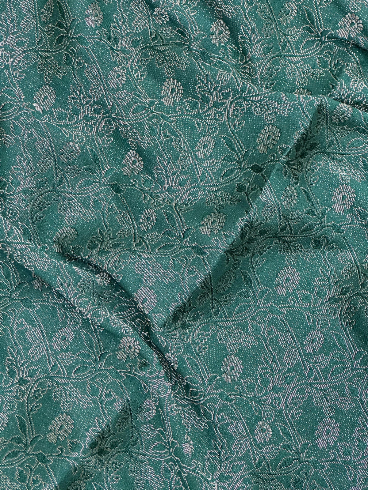 Woman wearing a Binny Crepe Saree with soft, flowing drape and minimal sheen, ideal for office and everyday wear.