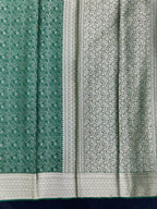 Woman wearing a Binny Crepe Saree with soft, flowing drape and minimal sheen, ideal for office and everyday wear.