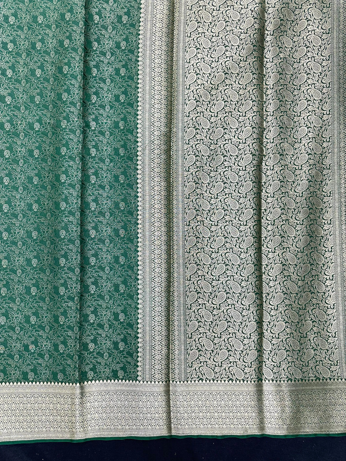 Woman wearing a Binny Crepe Saree with soft, flowing drape and minimal sheen, ideal for office and everyday wear.