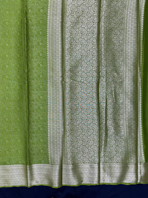 Woman wearing a Binny Crepe Saree with soft, flowing drape and minimal sheen, ideal for office and everyday wear.