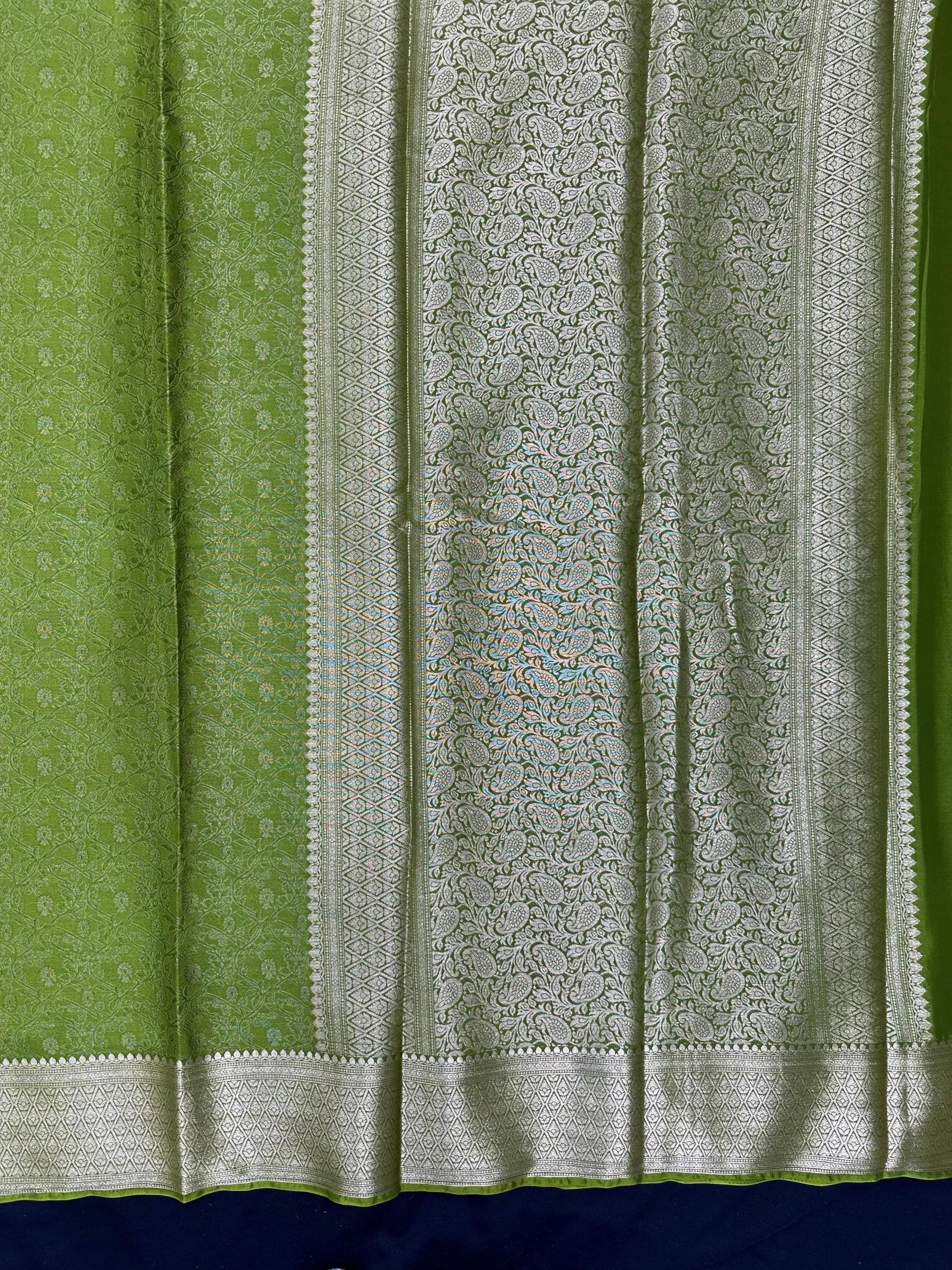 Woman wearing a Binny Crepe Saree with soft, flowing drape and minimal sheen, ideal for office and everyday wear.