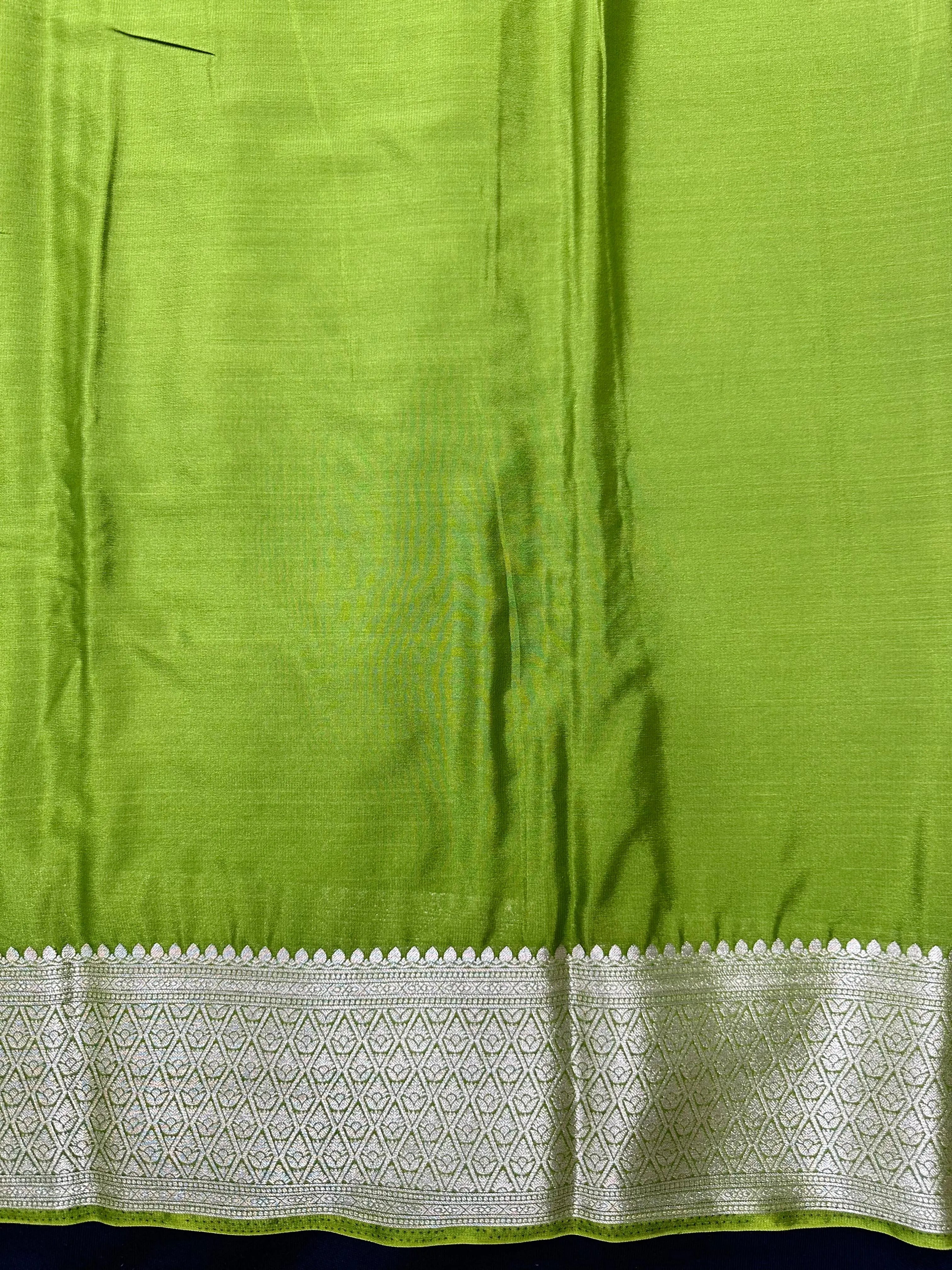 Woman wearing a Binny Crepe Saree with soft, flowing drape and minimal sheen, ideal for office and everyday wear.