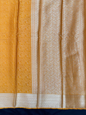 Woman wearing a Binny Crepe Saree with soft, flowing drape and minimal sheen, ideal for office and everyday wear.