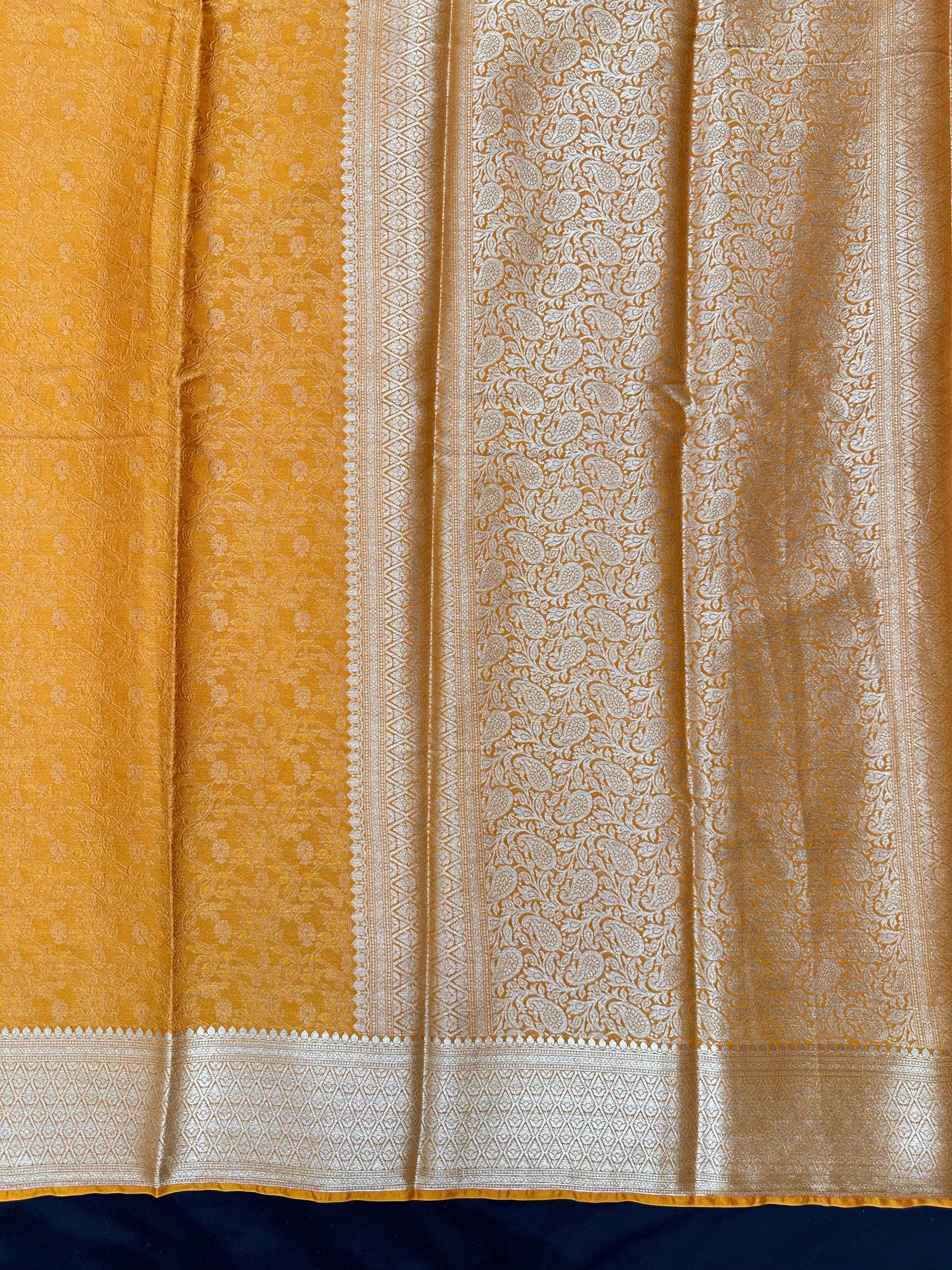 Woman wearing a Binny Crepe Saree with soft, flowing drape and minimal sheen, ideal for office and everyday wear.
