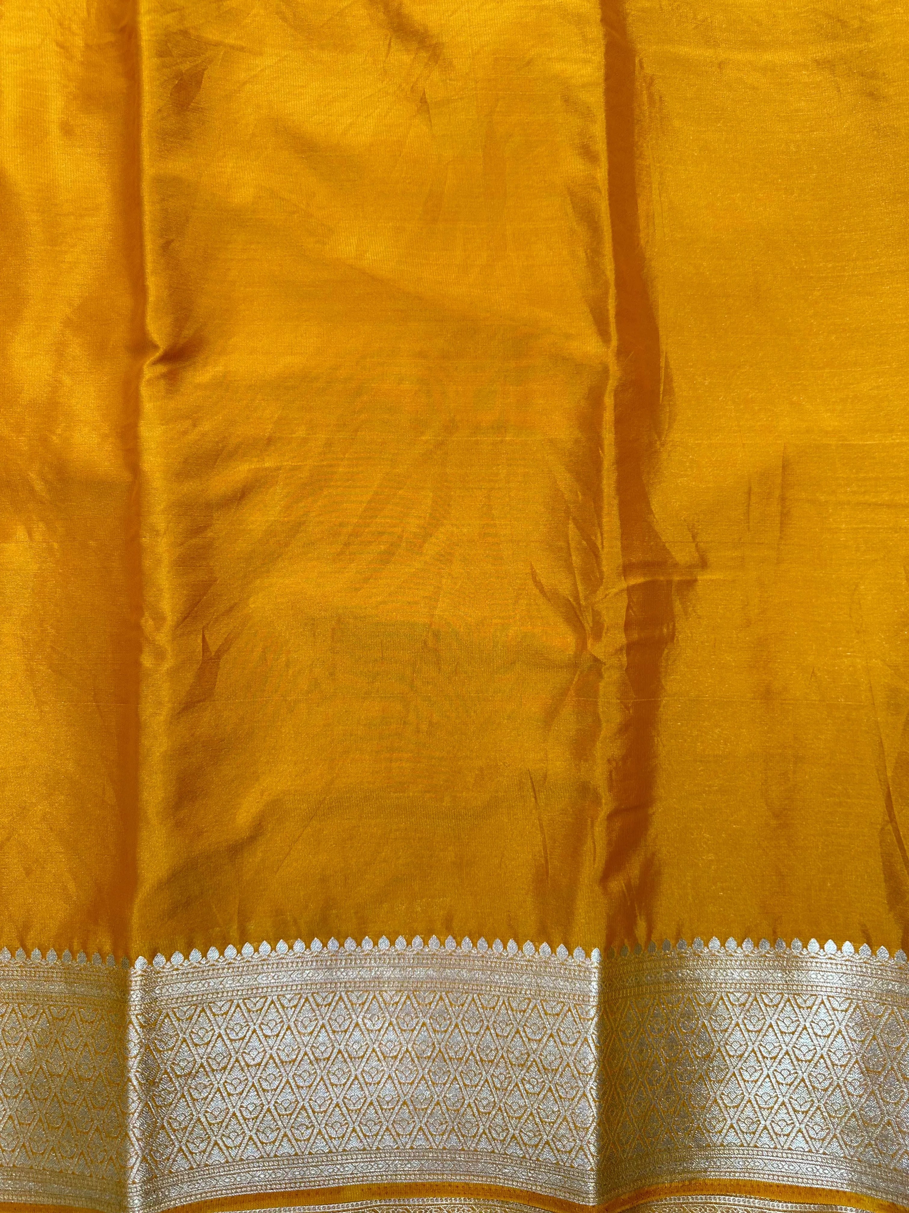 Woman wearing a Binny Crepe Saree with soft, flowing drape and minimal sheen, ideal for office and everyday wear.