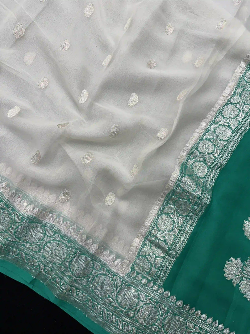 Banarasi Pure Khaddi Chiffon Silver Zari White Colour Saree With Contrast Rama Green Blouse & Pallu