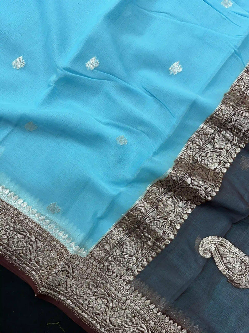 Banarasi Pure Khaddi Chiffon Silver Zari Sky Blue Colour Saree With Contrast Red Blouse & Pallu