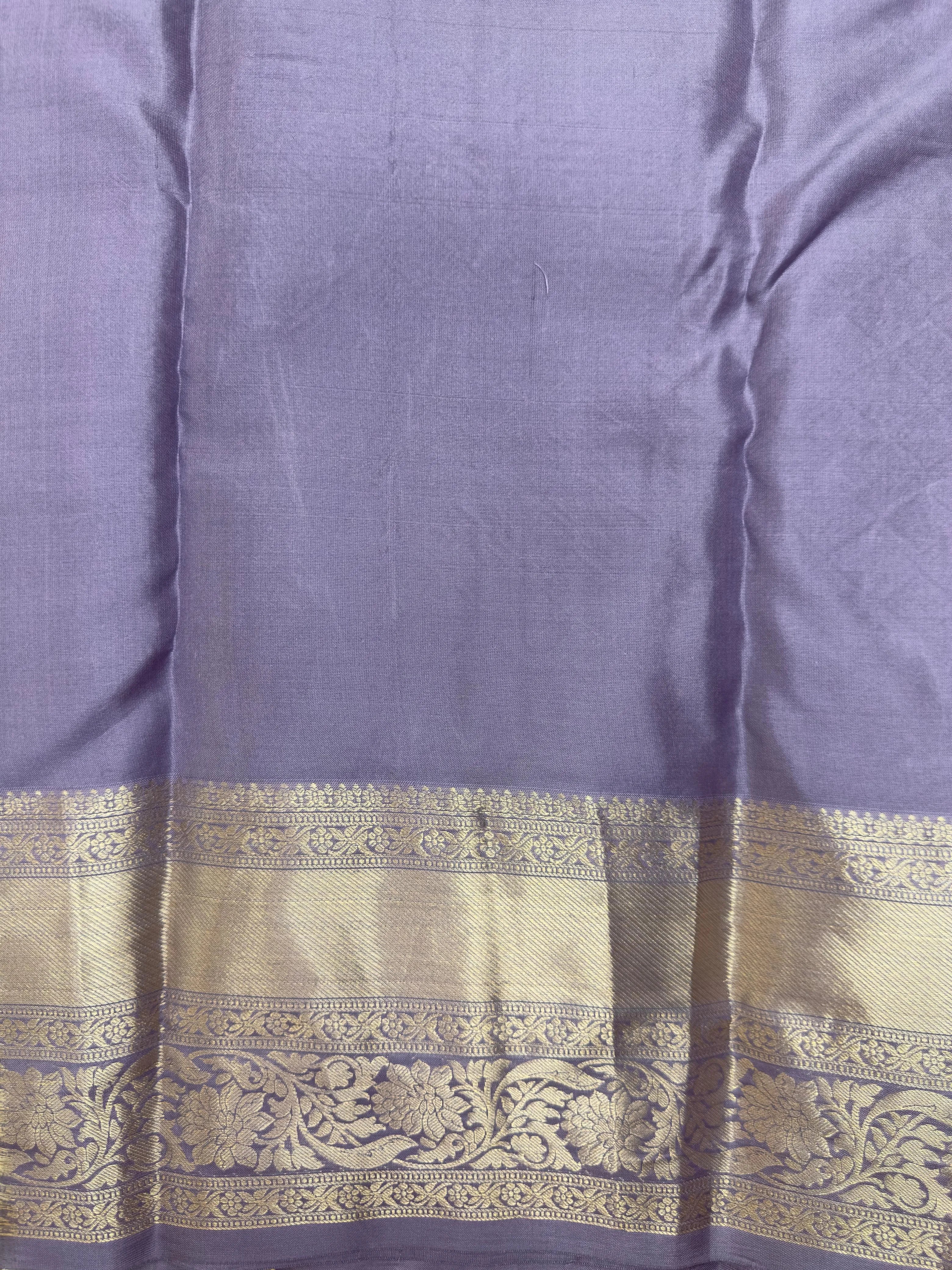 "Traditional Pure Kanjivaram Silk Saree with intricate zari work and vibrant colors, perfect ethnic wear for festive celebrations and special occasions."