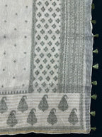 Woman wearing a Linen Silk Saree with soft, breathable texture and subtle shine, ideal for office wear and casual festive occasions.
