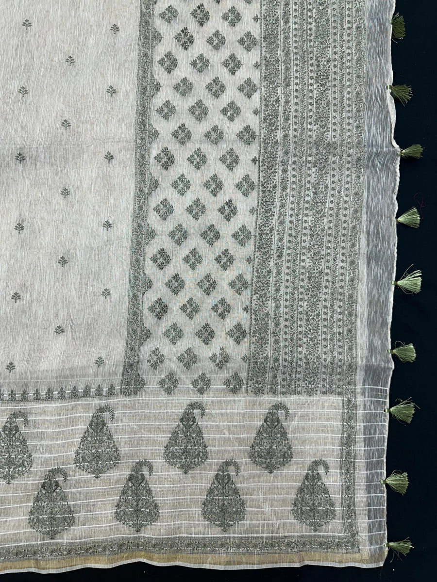 Woman wearing a Linen Silk Saree with soft, breathable texture and subtle shine, ideal for office wear and casual festive occasions.