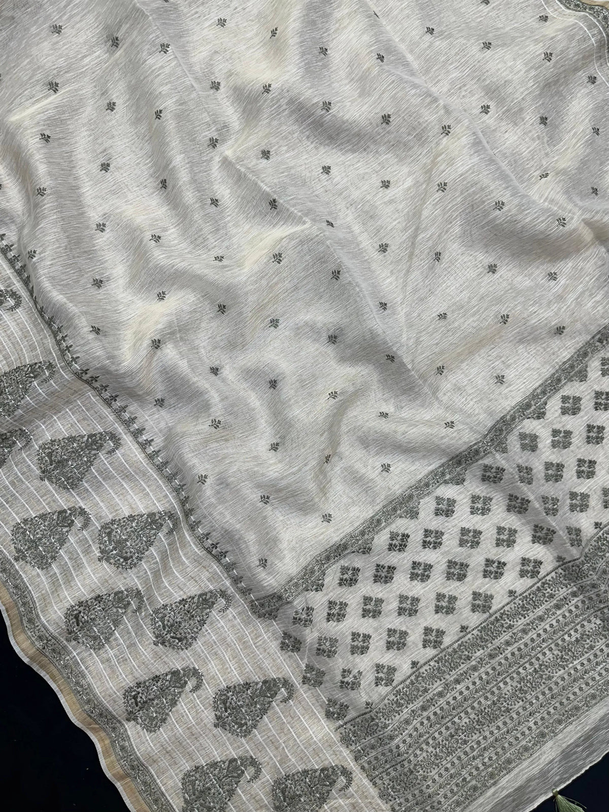 Woman wearing a Linen Silk Saree with soft, breathable texture and subtle shine, ideal for office wear and casual festive occasions.