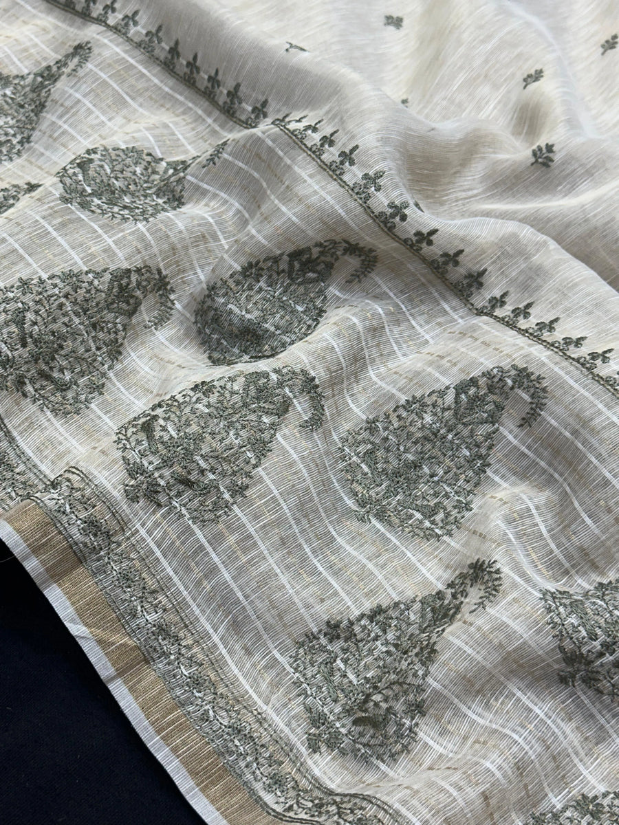 Woman wearing a Linen Silk Saree with soft, breathable texture and subtle shine, ideal for office wear and casual festive occasions.