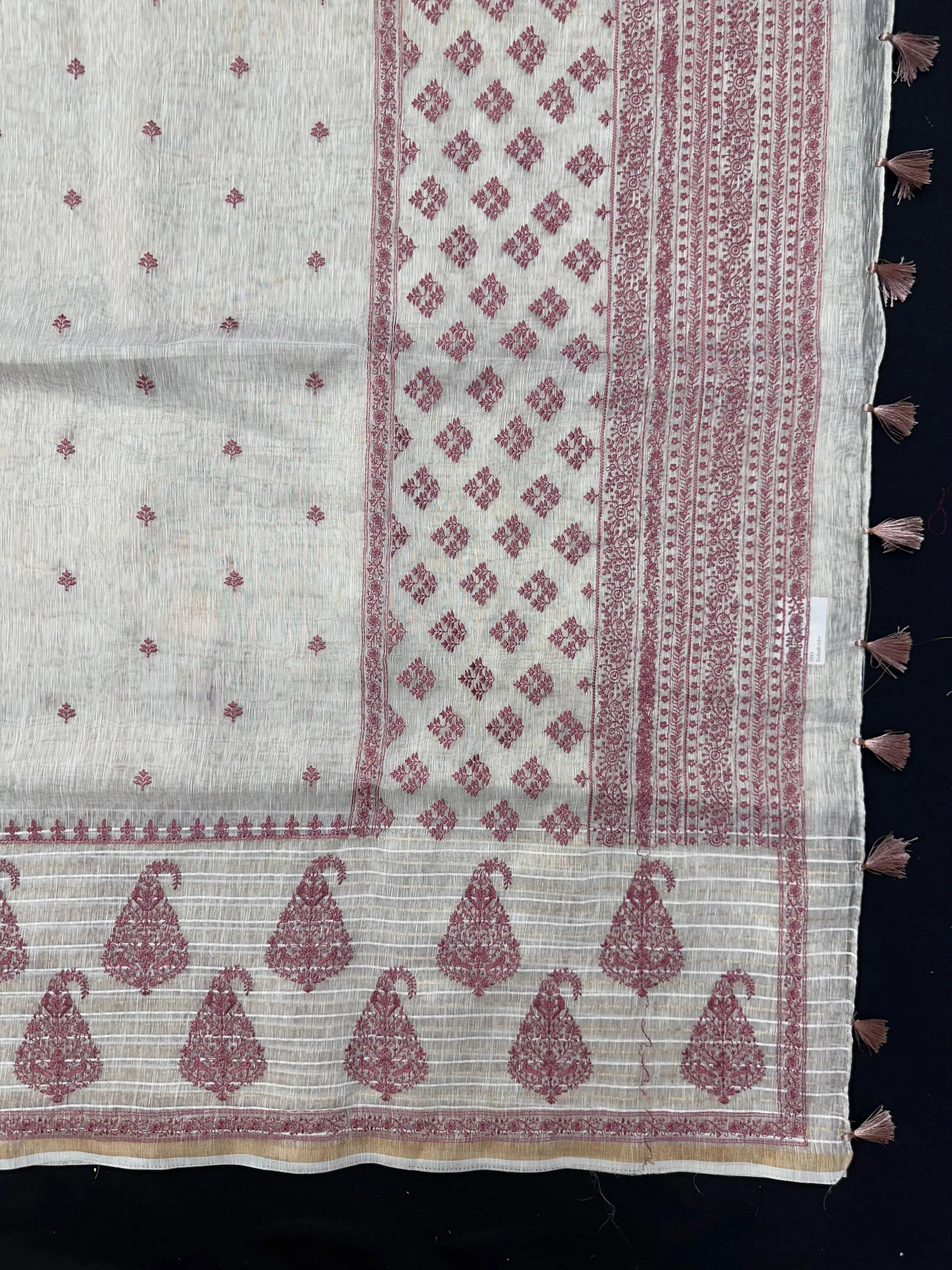 Woman wearing a Linen Silk Saree with soft, breathable texture and subtle shine, ideal for office wear and casual festive occasions.