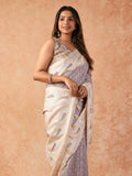 Woman wearing a Milky Cutwork Tussar Silk Saree with delicate embroidery and soft drape, ideal for weddings, receptions, and festive occasions.