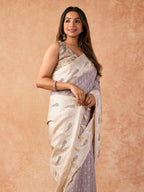 Woman wearing a Milky Cutwork Tussar Silk Saree with delicate embroidery and soft drape, ideal for weddings, receptions, and festive occasions.