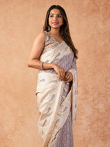 Woman wearing a Milky Cutwork Tussar Silk Saree with delicate embroidery and soft drape, ideal for weddings, receptions, and festive occasions.