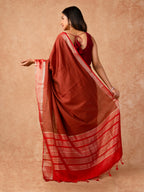 Woman wearing a Muggum Silk Saree with intricate embroidery and rich silk fabric, ideal for weddings, festivals, and traditional events.