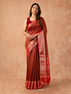 Woman wearing a Muggum Silk Saree with intricate embroidery and rich silk fabric, ideal for weddings, festivals, and traditional events.