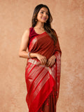 Woman wearing a Muggum Silk Saree with intricate embroidery and rich silk fabric, ideal for weddings, festivals, and traditional events.