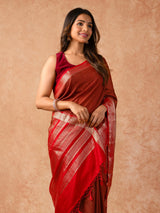 Woman wearing a Muggum Silk Saree with intricate embroidery and rich silk fabric, ideal for weddings, festivals, and traditional events.