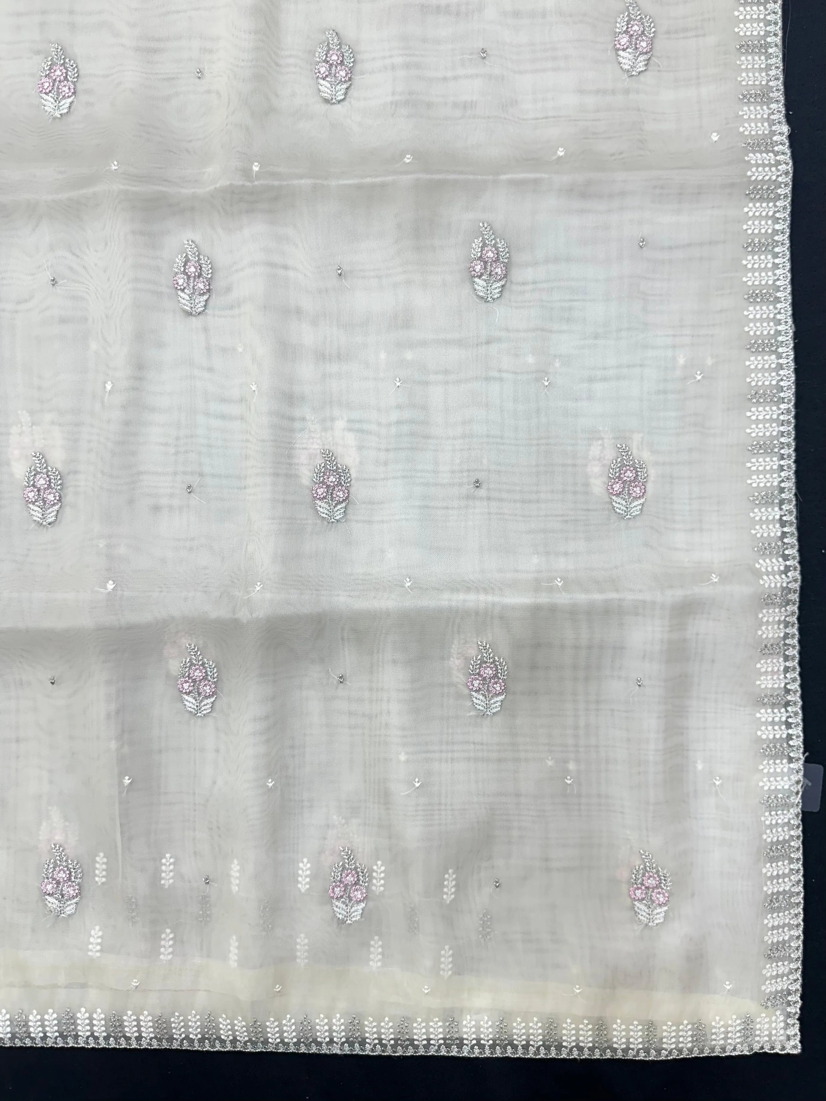 Woman wearing a sheer Organza Saree with elegant detailing and soft flow, perfect for festive events and stylish ethnic occasions.
