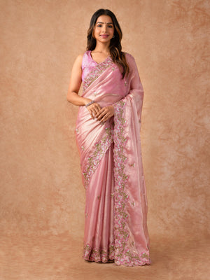 Woman wearing an Organza Saree with sheer, lightweight fabric and elegant drape, ideal for weddings, parties, and festive celebrations.