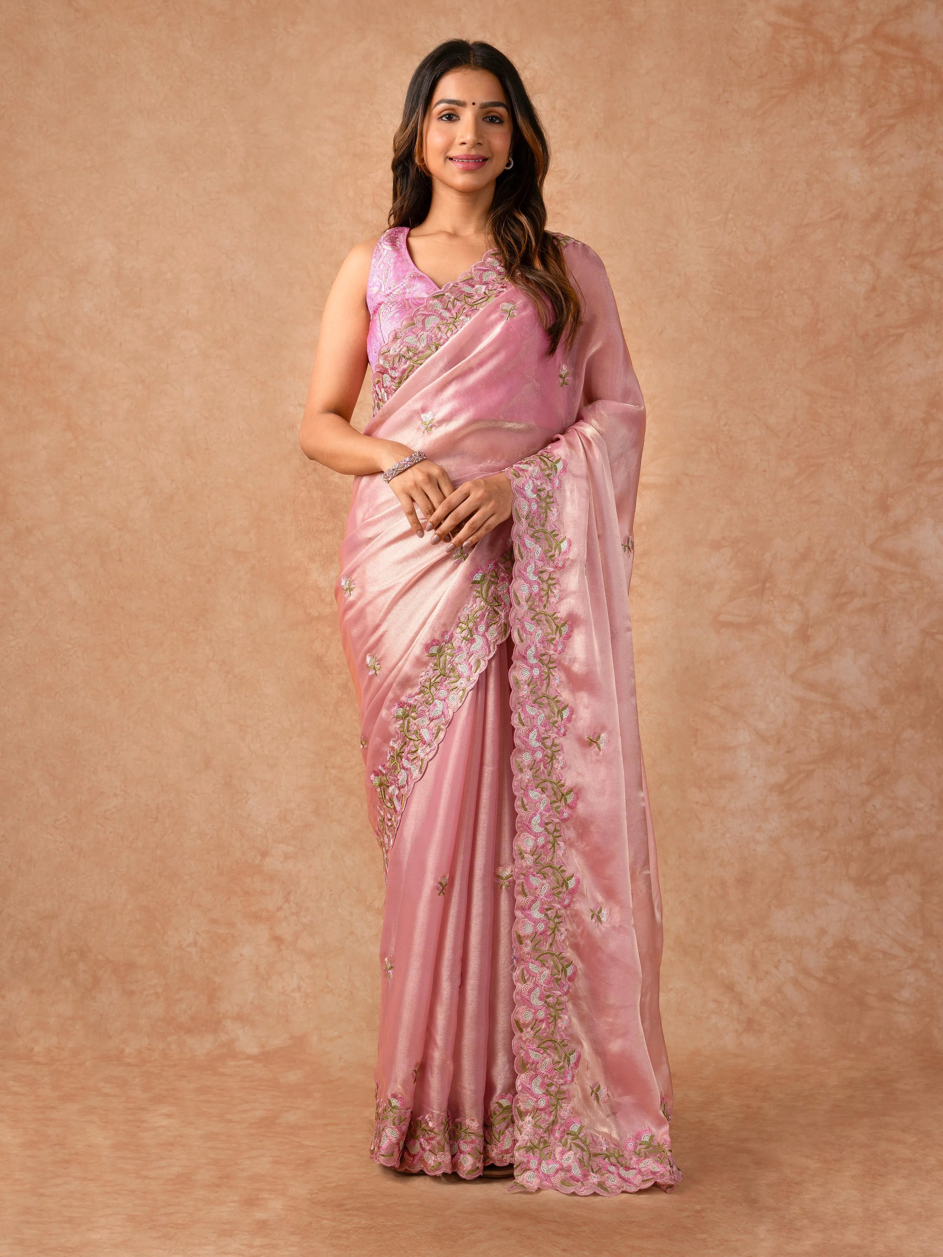 Woman wearing an Organza Saree with sheer, lightweight fabric and elegant drape, ideal for weddings, parties, and festive celebrations.