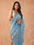 Woman wearing a Paper Silk Saree with lightweight, crisp texture and subtle sheen, ideal for office, casual, and festive occasions.