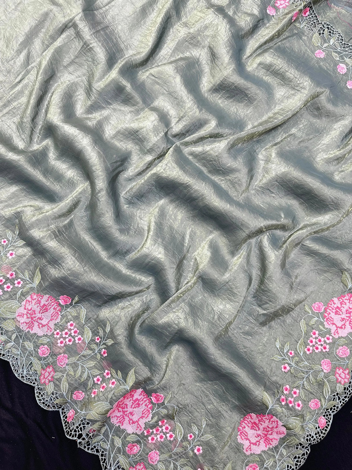 Woman wearing a Paper Silk Saree with crisp texture and elegant drape, ideal for office wear, casual events, and festive occasions.