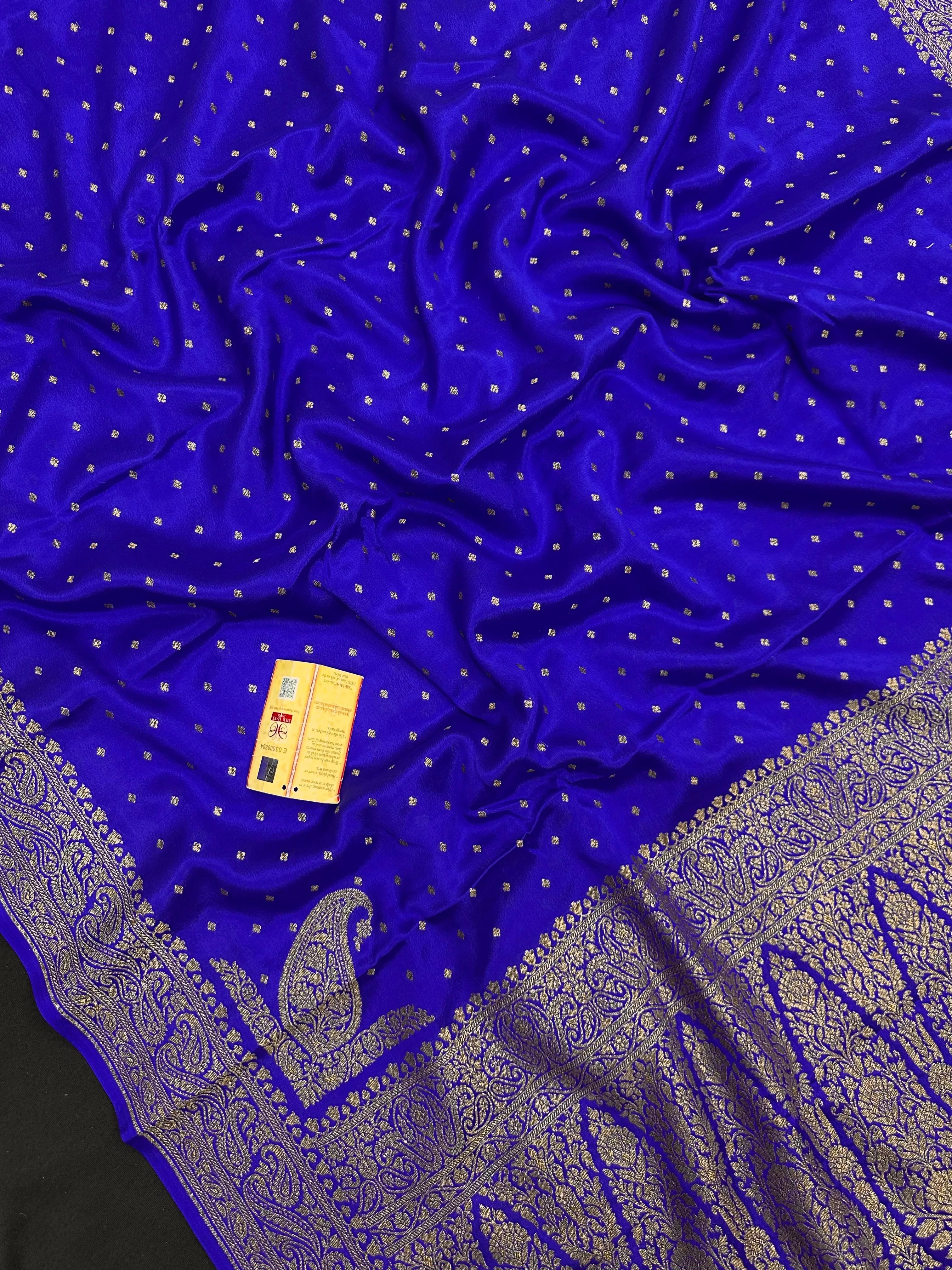 Pure Banarasi crepe silk saree with rich zari work and soft flowing texture – ideal for weddings and festive occasions