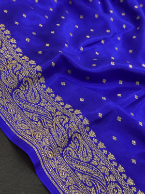 Pure Banarasi crepe silk saree with rich zari work and soft flowing texture – ideal for weddings and festive occasions