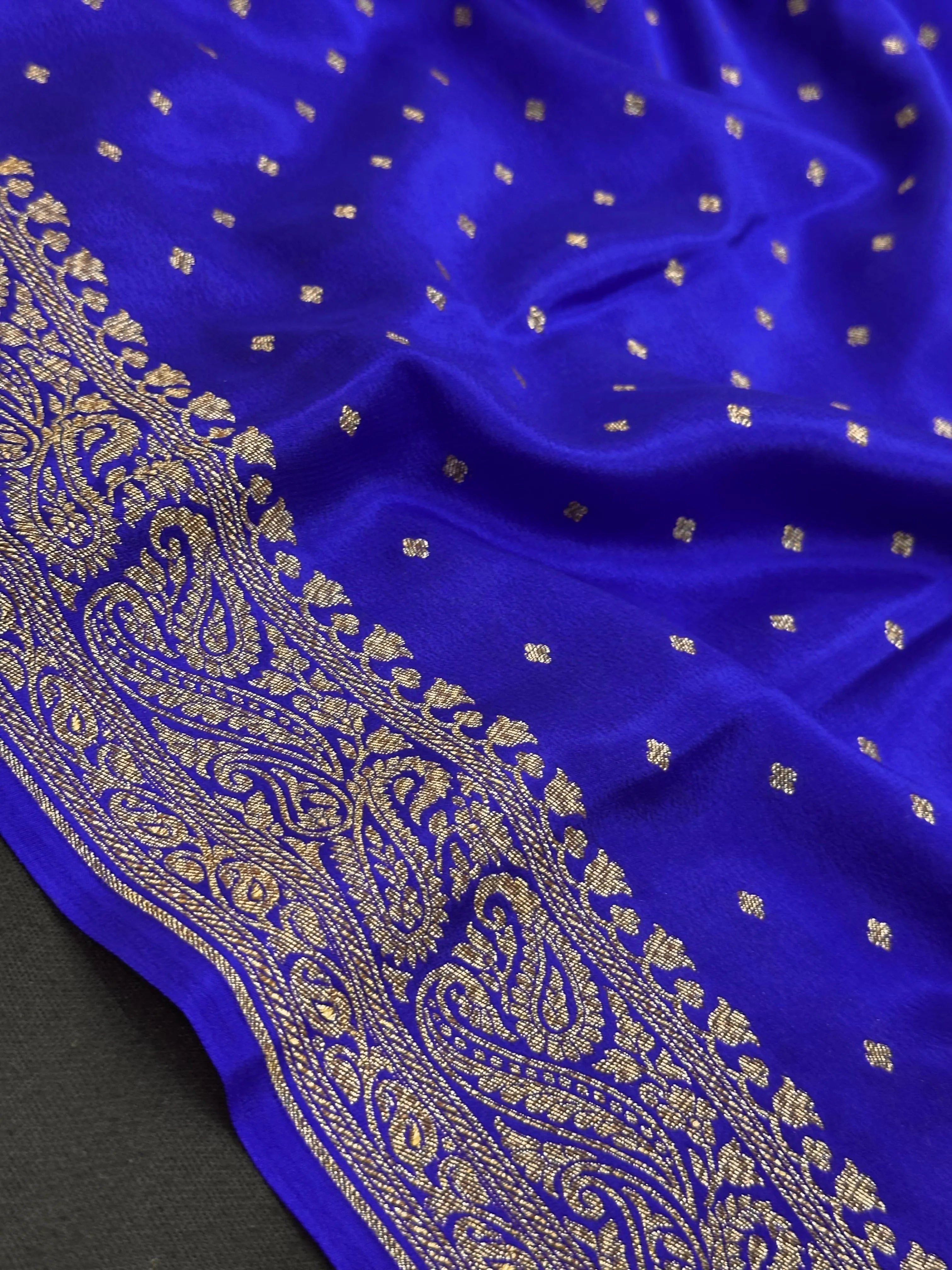 Pure Banarasi crepe silk saree with rich zari work and soft flowing texture – ideal for weddings and festive occasions