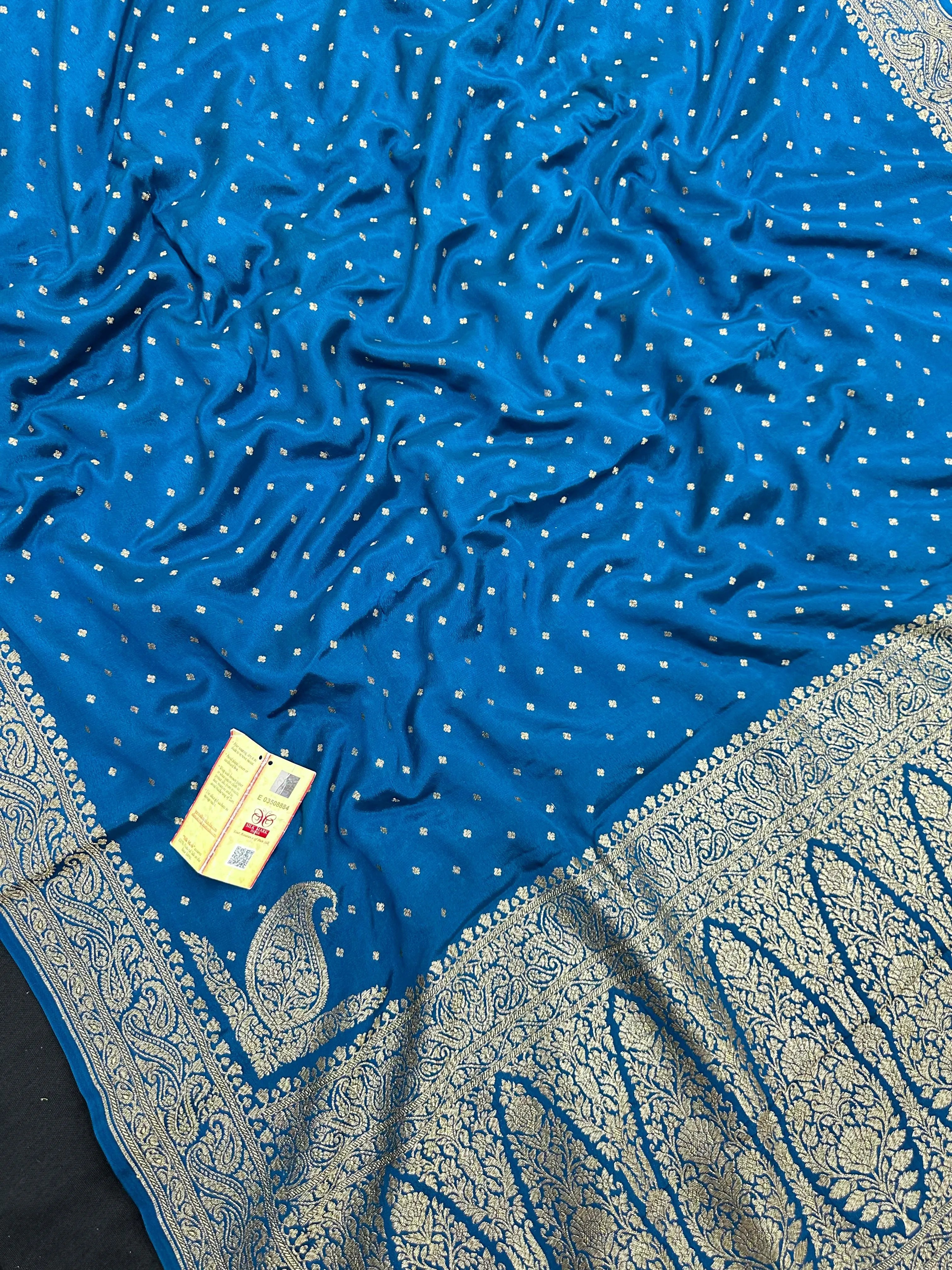 Pure Banarasi crepe silk saree with rich zari work and soft flowing texture – ideal for weddings and festive occasions