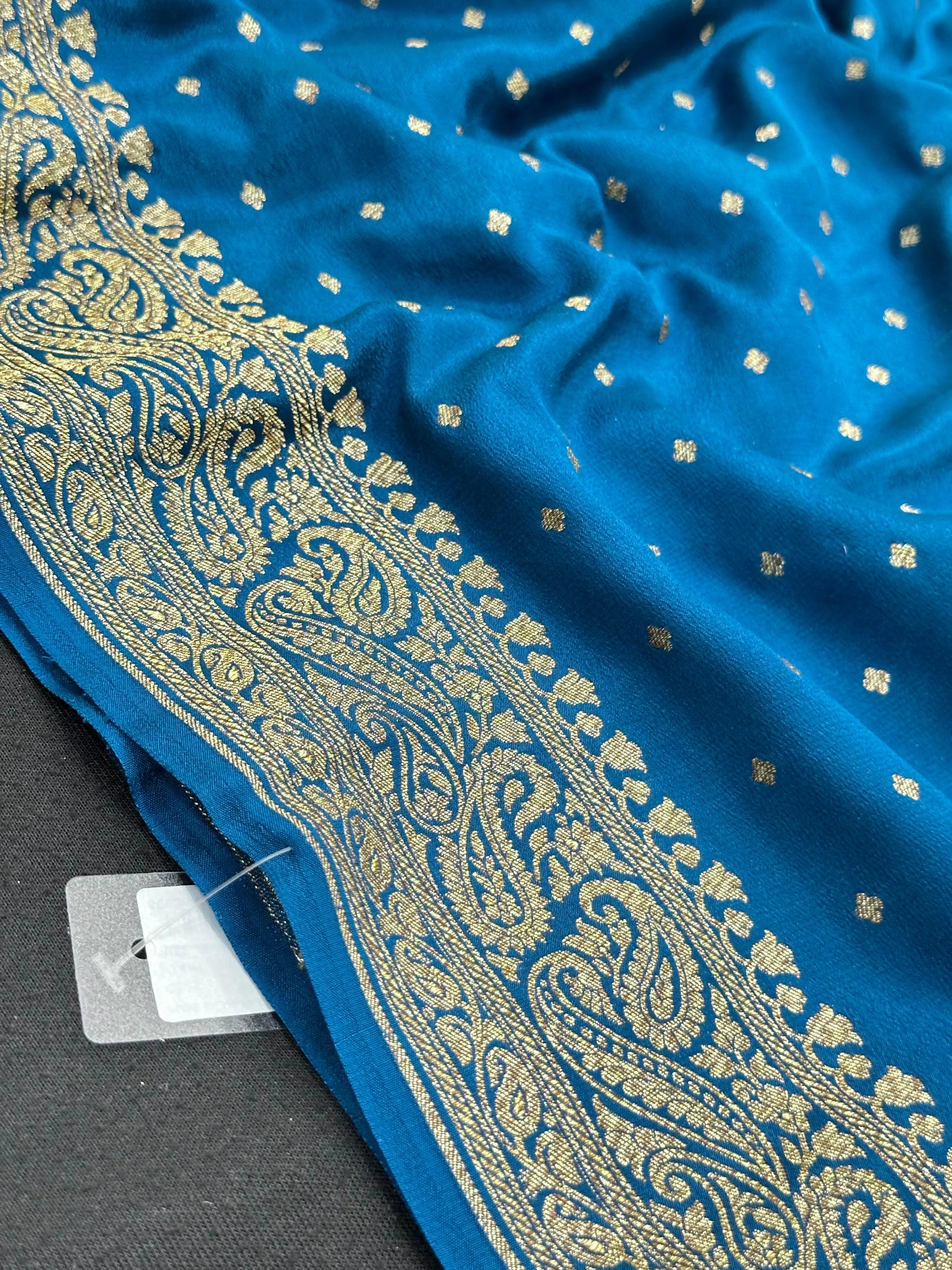 Pure Banarasi crepe silk saree with rich zari work and soft flowing texture – ideal for weddings and festive occasions