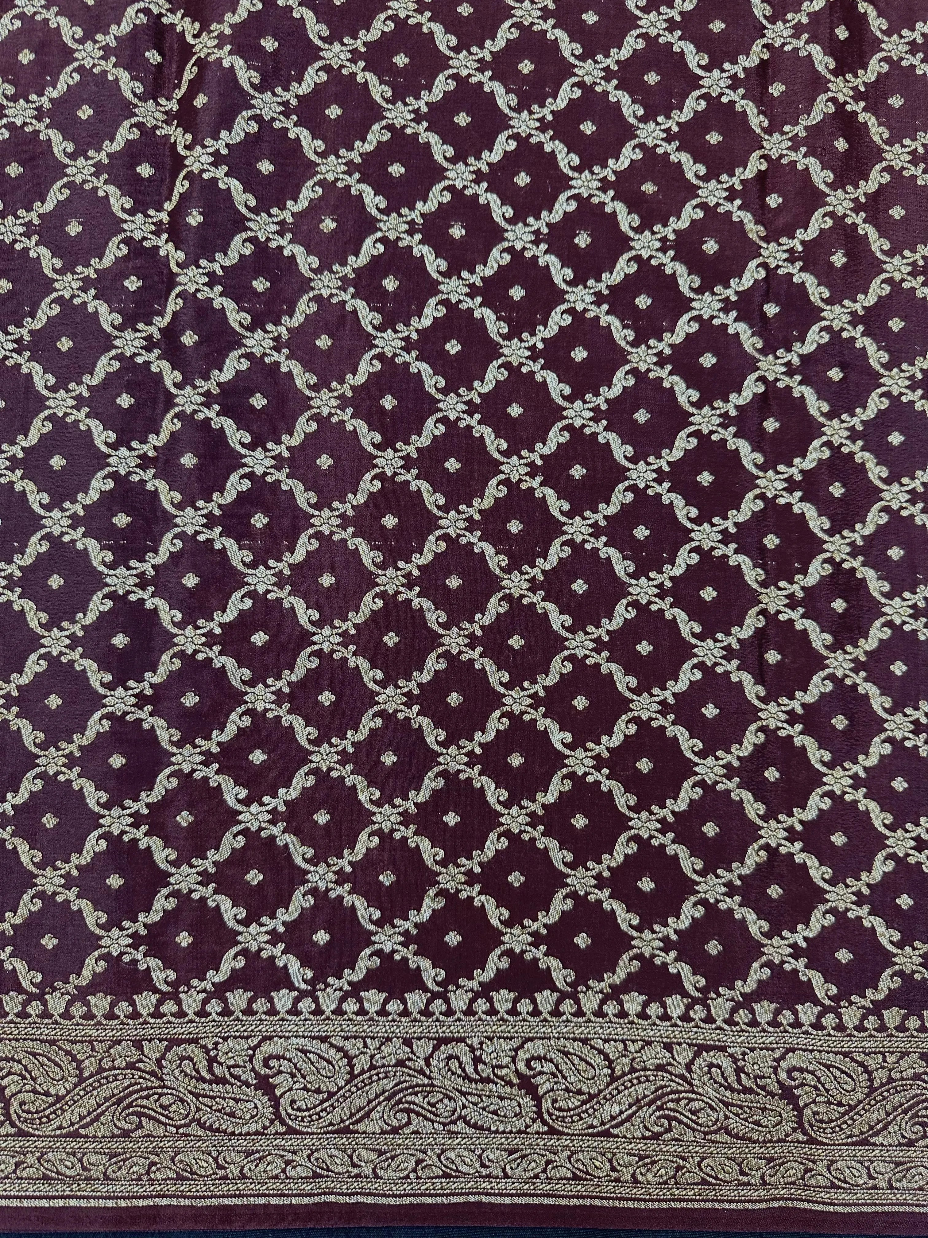 Pure Banarasi crepe silk saree with rich zari work and soft flowing texture – ideal for weddings and festive occasions
