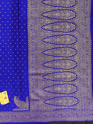 Pure Banarasi crepe silk saree with rich zari work and soft flowing texture – ideal for weddings and festive occasions