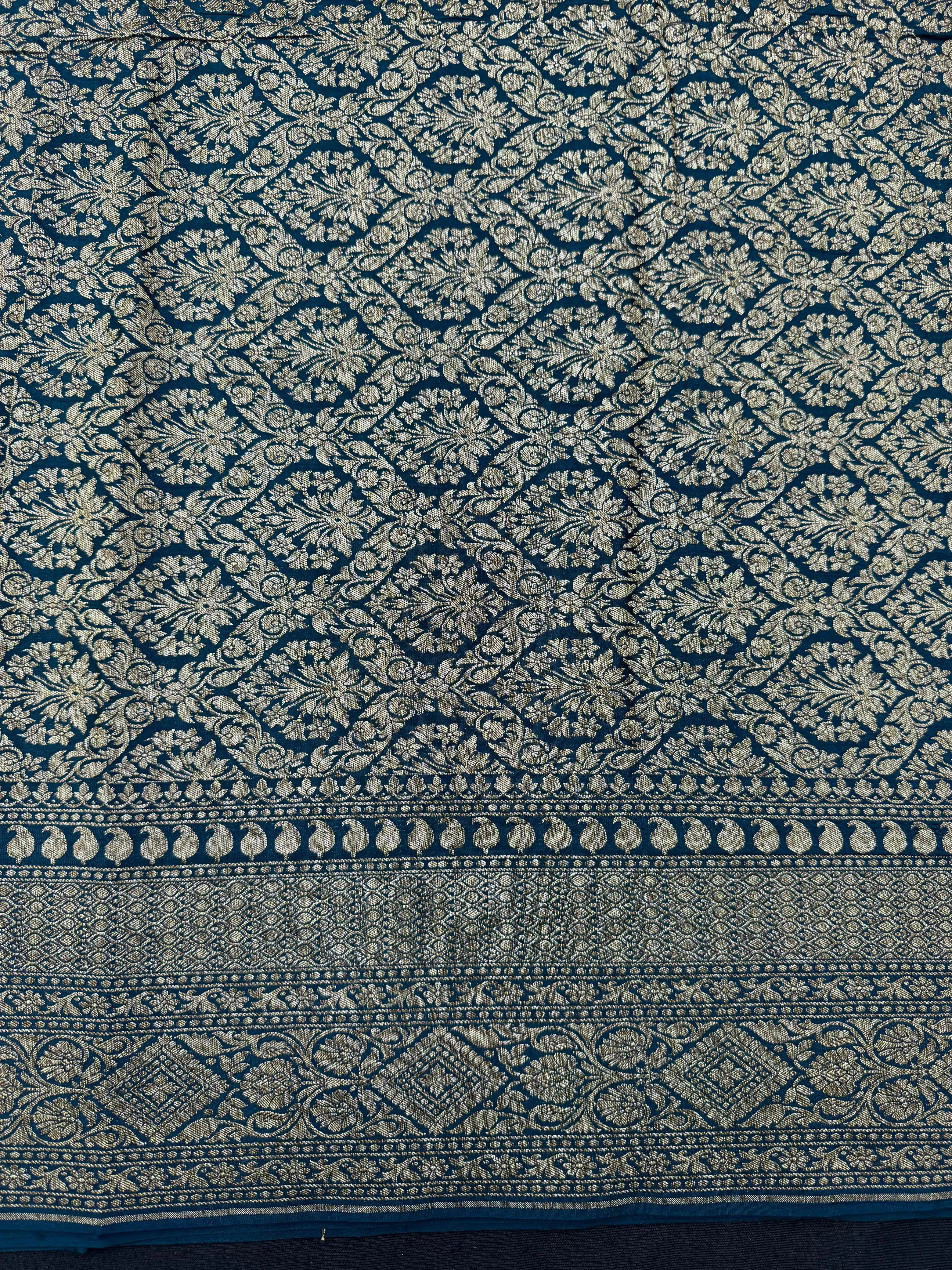 Pure Banarasi crepe silk saree with rich zari detailing and soft drape – ideal for festive and bridal occasions