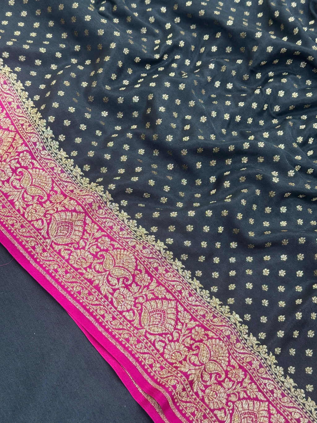 Woman draped in a Pure Banarasi Crepe Silk Saree with soft crepe texture and intricate zari work, perfect for weddings and festive occasions.