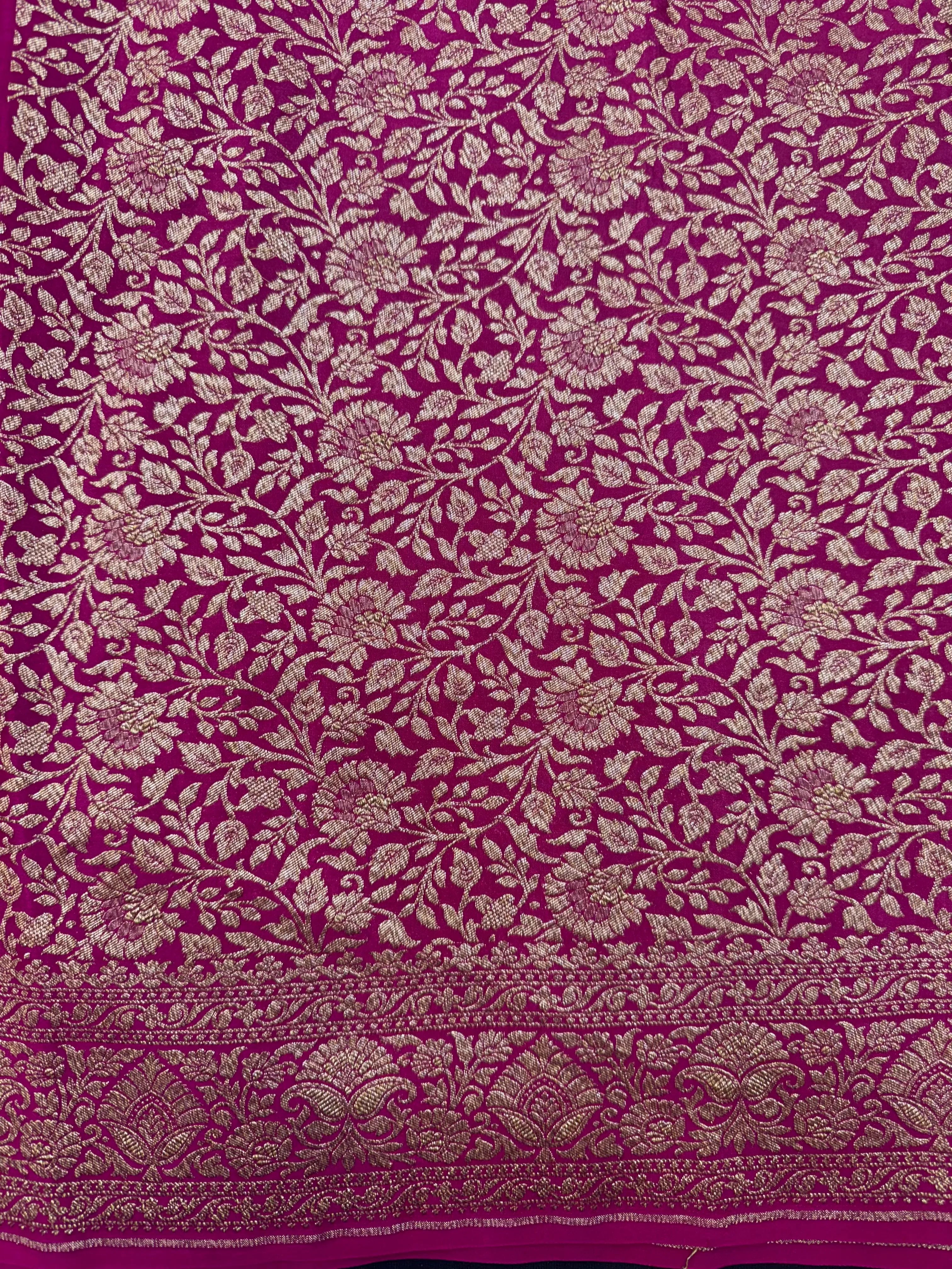 Woman draped in a Pure Banarasi Crepe Silk Saree with soft crepe texture and intricate zari work, perfect for weddings and festive occasions.