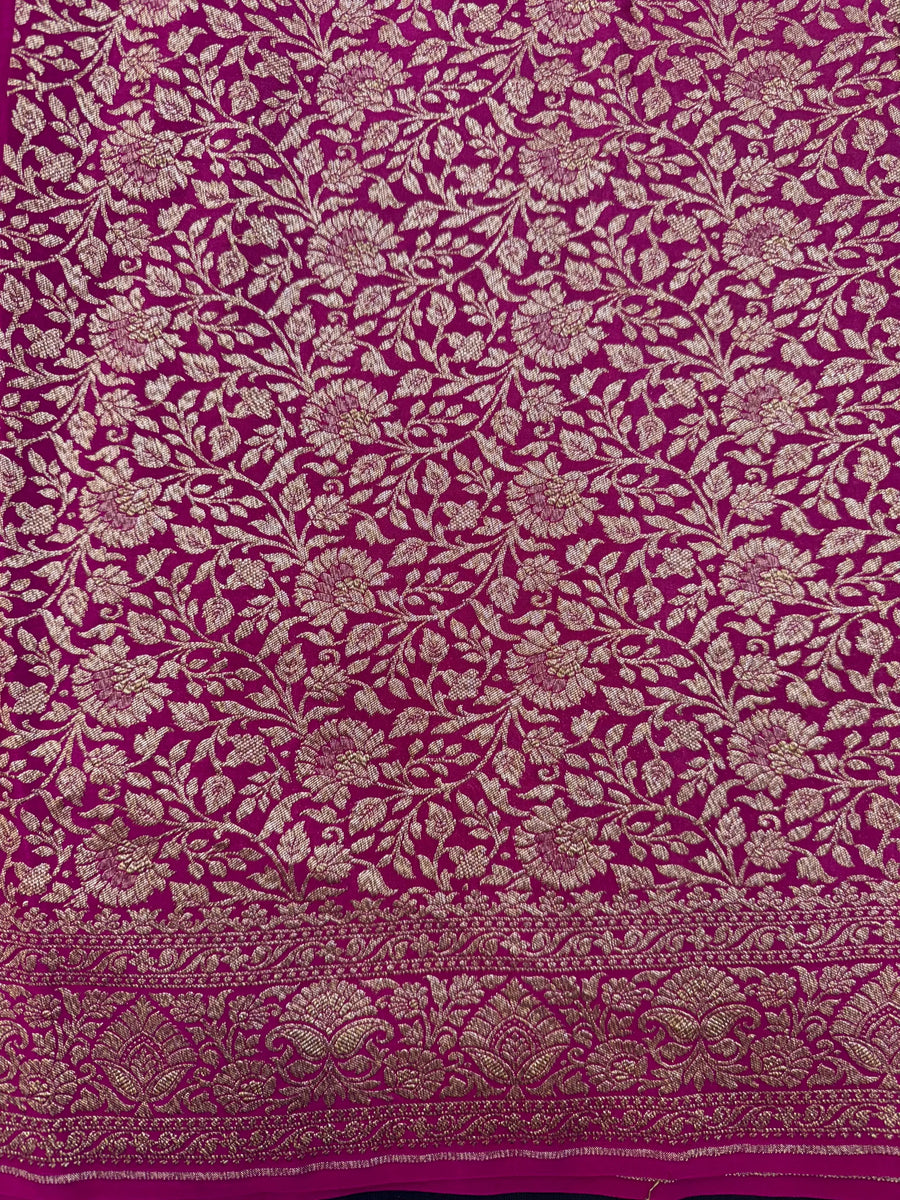 Woman draped in a Pure Banarasi Crepe Silk Saree with soft crepe texture and intricate zari work, perfect for weddings and festive occasions.