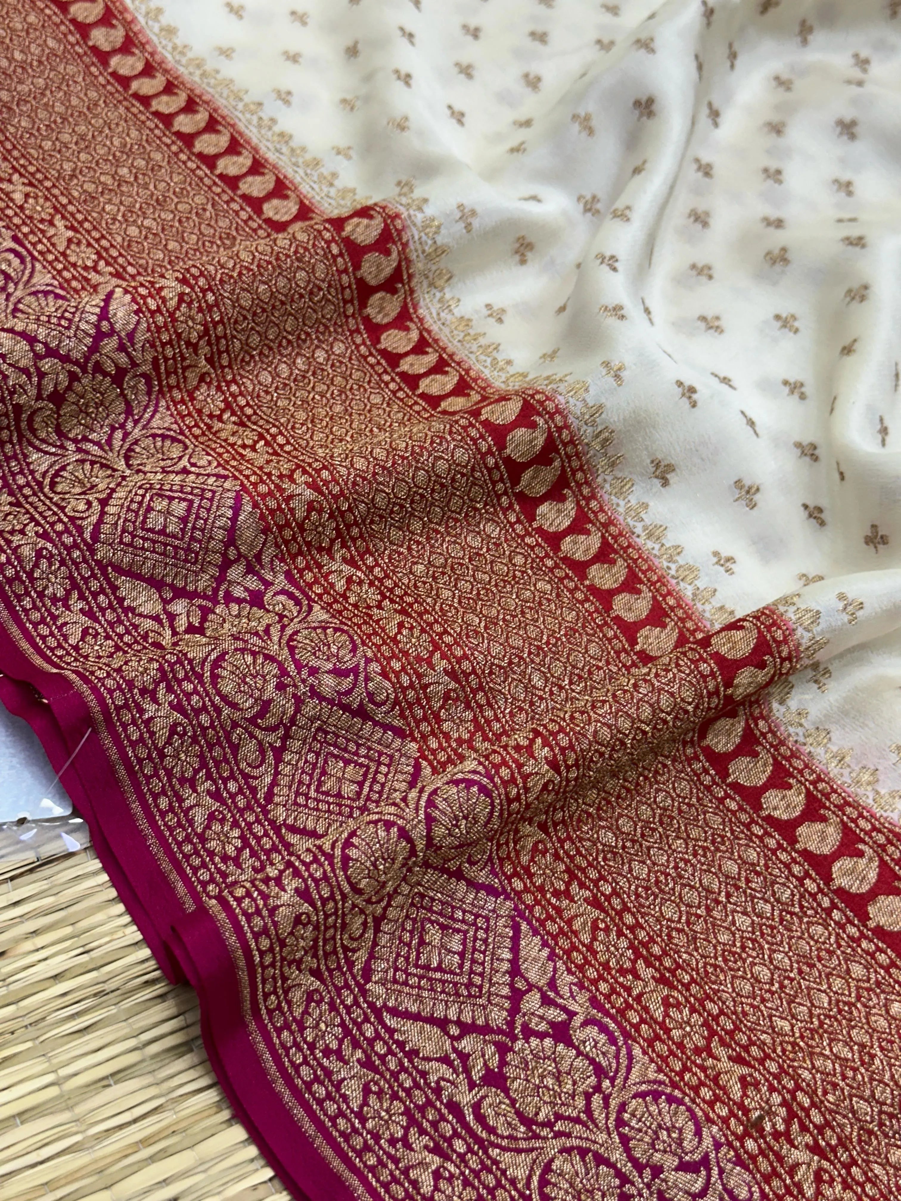 "Graceful White Pure Banarasi Crepe Silk Saree with intricate handwoven floral and paisley motifs, perfect for weddings and celebrations. The luxurious fabric drapes elegantly, offering timeless beauty and comfort."